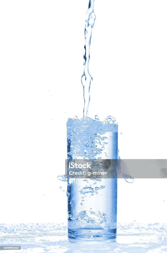 Water splashes in the glass Water splashes in the glass on white background Activity Stock Photo