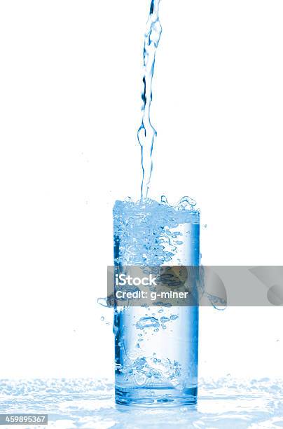 Water Splashes In The Glass Stock Photo - Download Image Now - Activity, Alcohol - Drink, Blue