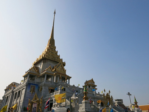 Bangkok, Thailand – December 22, 2013 –  A view of the Temple,Wat Traimit, in China Town in Bangkok, Thailand. Locals and tourists pay a visit at the temple.