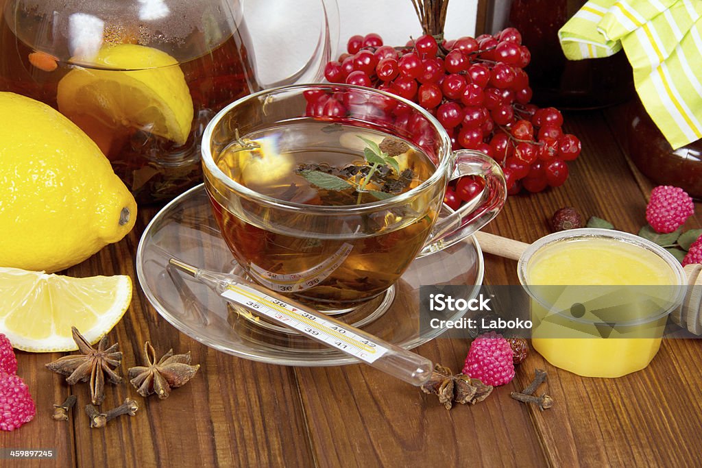 Tea with honey and lemoon Tea with honey and lemoon on wood table Anise Stock Photo