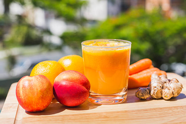 Glass of fresh fruit and vegetable juice stock photo