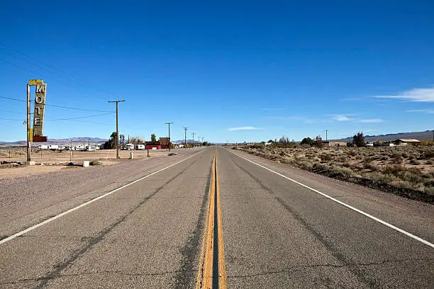 Decayed portion of historic Route 66 in the middle of California's vast Mojave desert.