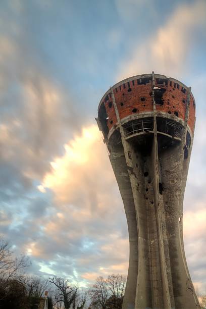 Vintage, rustic water tower at a grain mill at sunset in Clovis, New Mexico