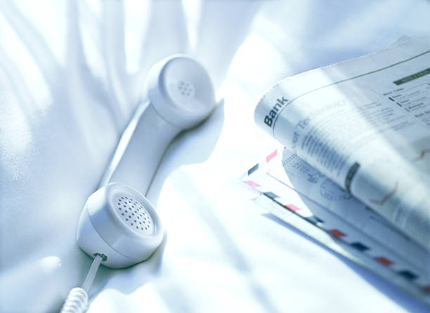 istock telephone and newspaper 459904961