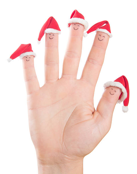 istock Fingers Christmas faces in Santa hats. 459906651