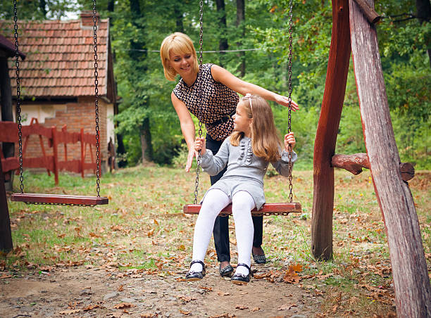 istock Mother And Child Relaxing In Park 459907937