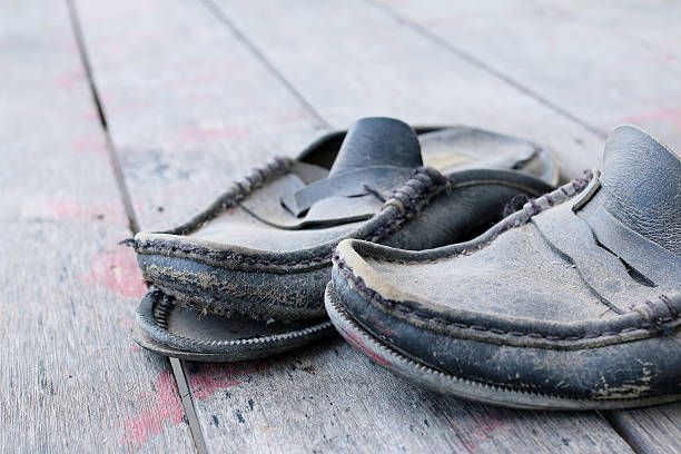 istock Old shoes on wooden floor 459910707