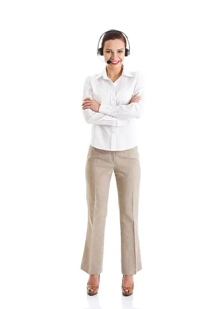 Photo of Beautiful woman standing with microphone and headphones.