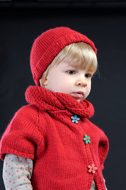 istock portrait of a with knitted hat on black 459911483