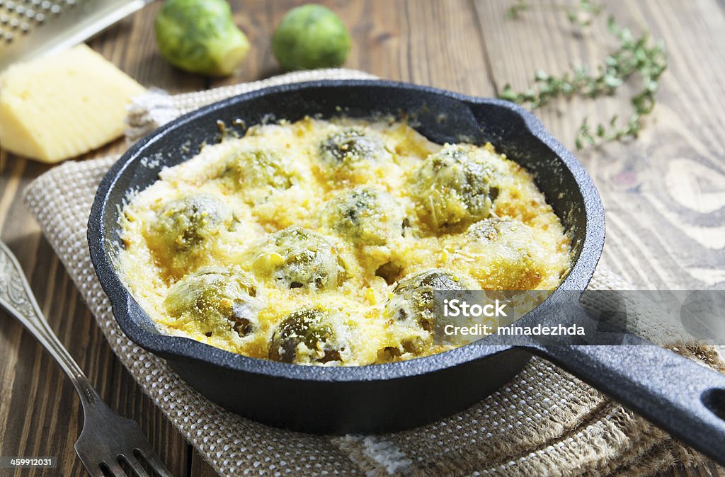 Casserole with brussels sprouts Casserole with brussels sprouts and cheese in a frying pan Brussels Sprout Stock Photo
