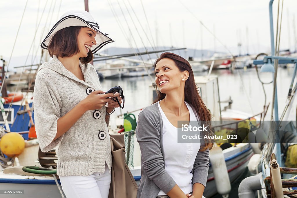 On the vacation! Happy women at the harbor, smiling face to face 20-29 Years Stock Photo