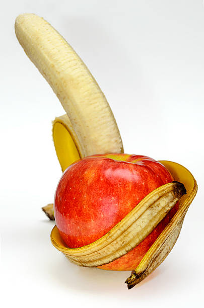 Apple arms banana stock photo