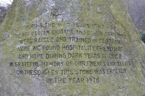 A section of text inscribed into a rock in a park in Edinburgh