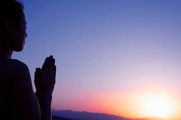 istock Serene young woman doing prayer pose in the desert 459915633