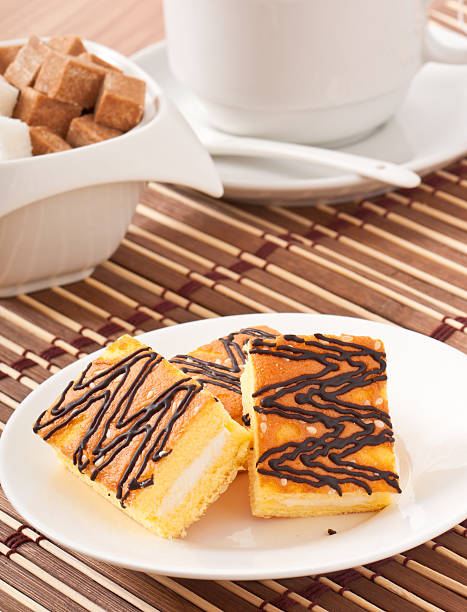 istock Slice of sponge cake with tea and sugar 459922731
