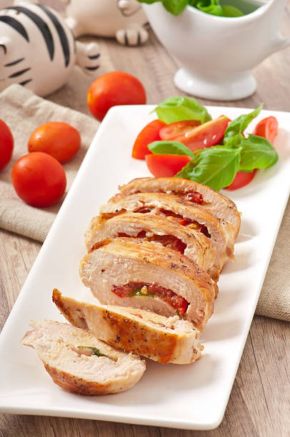 istock Grilled chicken breast stuffed with basil, tomato and garlic 459925085