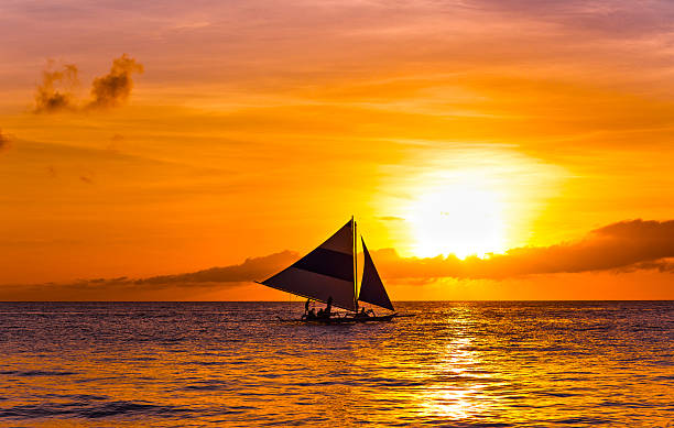 istock Amazing sunset at sea. Sailboat 459925465