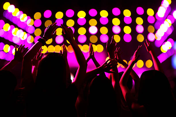 istock Audience watching a rock show, hands in the air 459926147