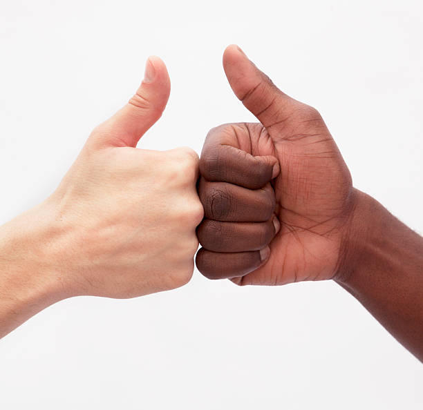 istock Two young men giving each other the thumbs up sign 459926753