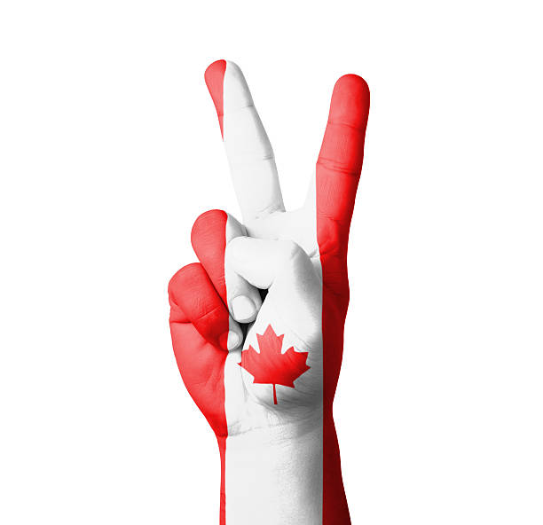 istock Hand making the V sign, Canada flag painted 459927517