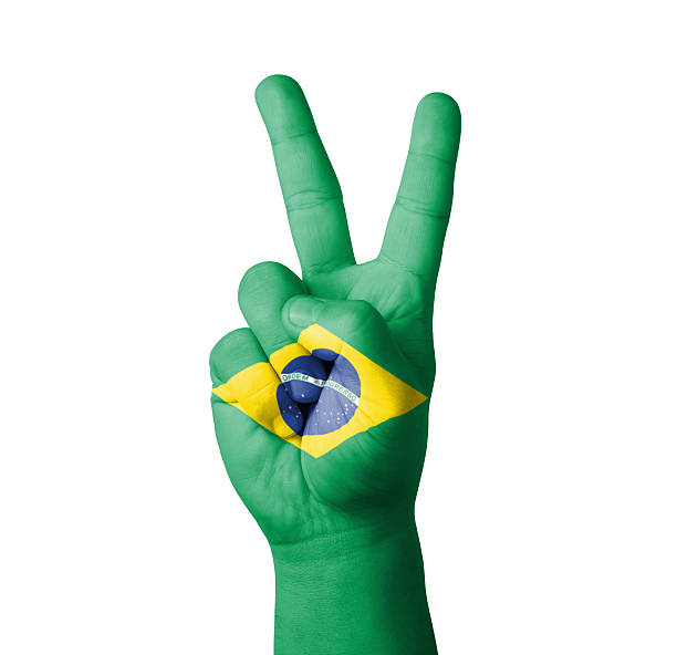 istock Hand making the V sign, Brazil flag painted 459927595