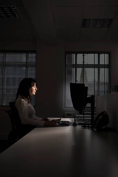 istock Businesswoman Working On Computer In Dark Office 459930721