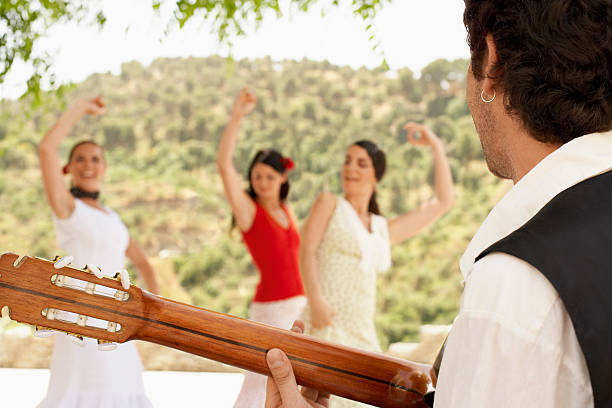 istock Man Playing Guitar With Women Dancing Flamenco 459931267