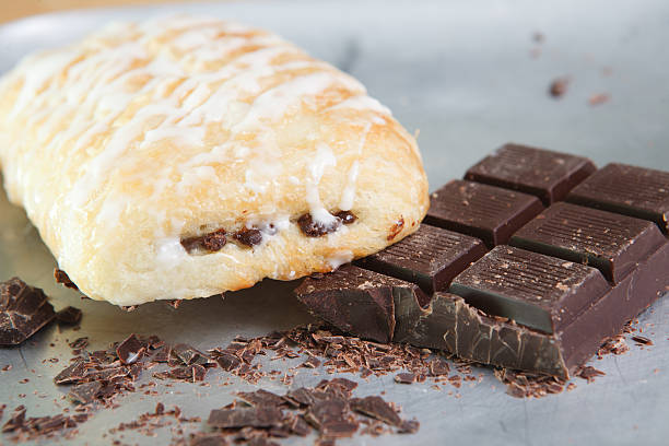 Chocolate croissant with icing stock photo