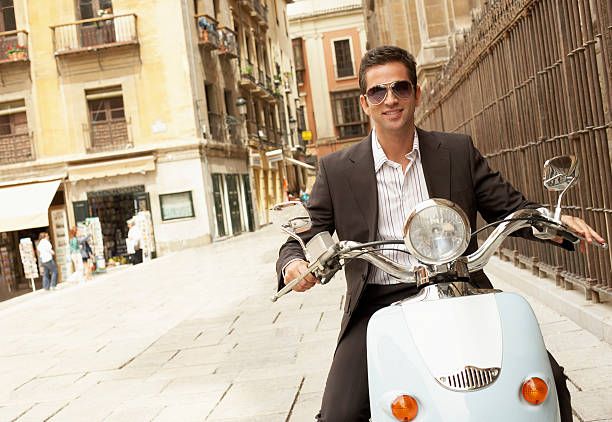 istock Businessman Riding Scooter Through Town 459934009
