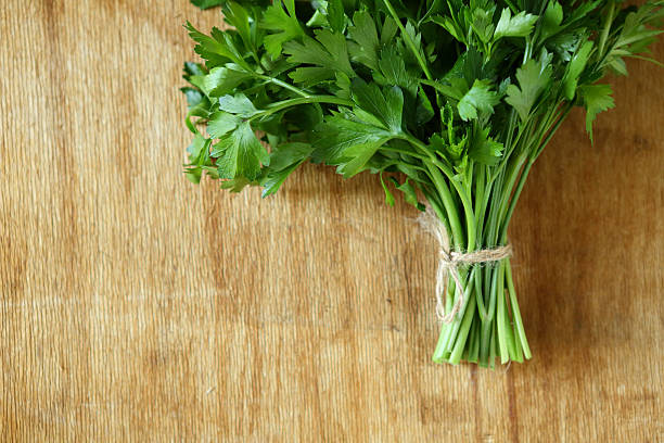 istock bundle of fresh herbs on a wooden surface 459935187