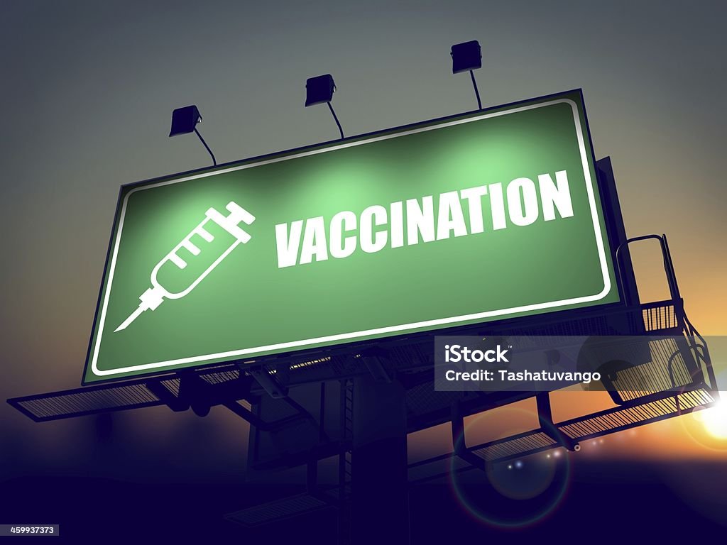 Vaccination - Billboard on the Sunrise Background. Vaccination - Green Billboard on the Rising Sun Background. Billboard Stock Photo
