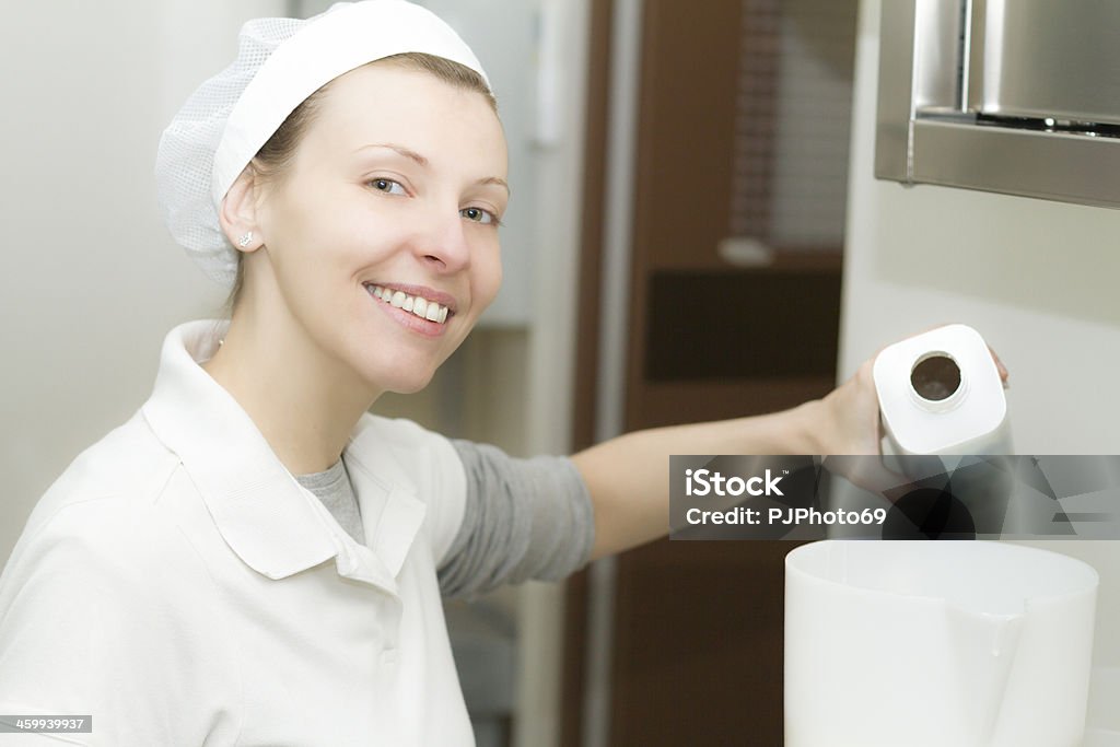 Chef pours milk in a container Chef pours milk in a container for ice cream 25-29 Years Stock Photo