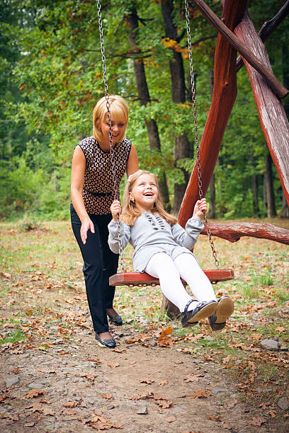 istock Mother And Child Relaxing In Park 459940051