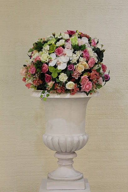 istock Colorful flowers in white vase. 459942047