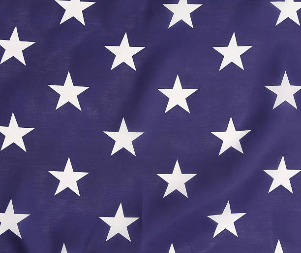 istock American Flag backlit blue with white stars. 459944441