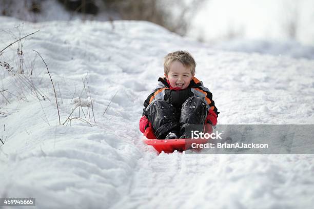 Sledging In The Snow Stock Photo - Download Image Now - Sledding, Child, Outdoors