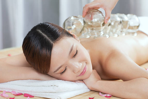 istock Young woman has Chinese medicine cupping on her back 459951613