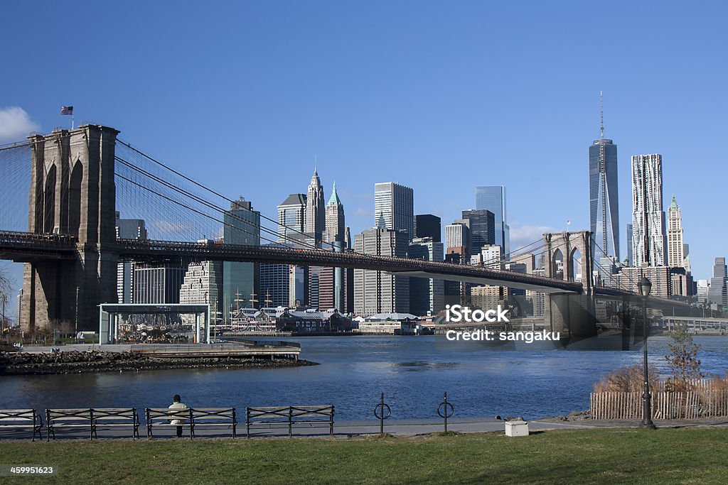 Manhattan and the Brooklyn Bridge - NYC Manhattan as seen from Brooklyn Bridge Park in DUMBO, Brooklyn. Architecture Stock Photo