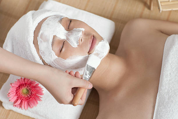 istock Woman doing facial mask 459953121