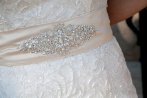 Fabric jeweled belt on a wedding dress