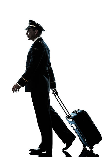 istock man in airline pilot uniform silhouette walking 459954151