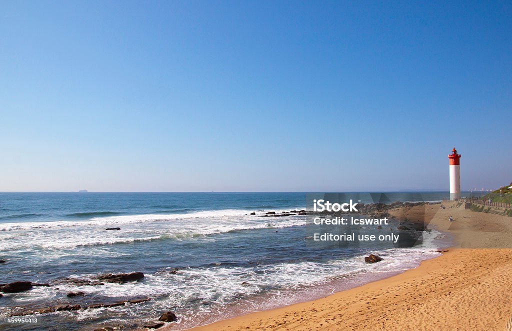 Seascape With Red And White Lighthouse At Umhlanga Rocks, Durban Durban, Souyh Africa - December 20, 2013: Seascape With Red And White Lighthouse At Umhlanga Rocks, Durban Architecture Stock Photo