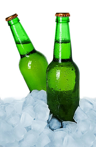 istock Two bottles of beer on ice isolated 459955839