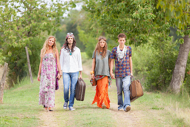 istock Hippie Group Walking on a Countryside Road 459957369