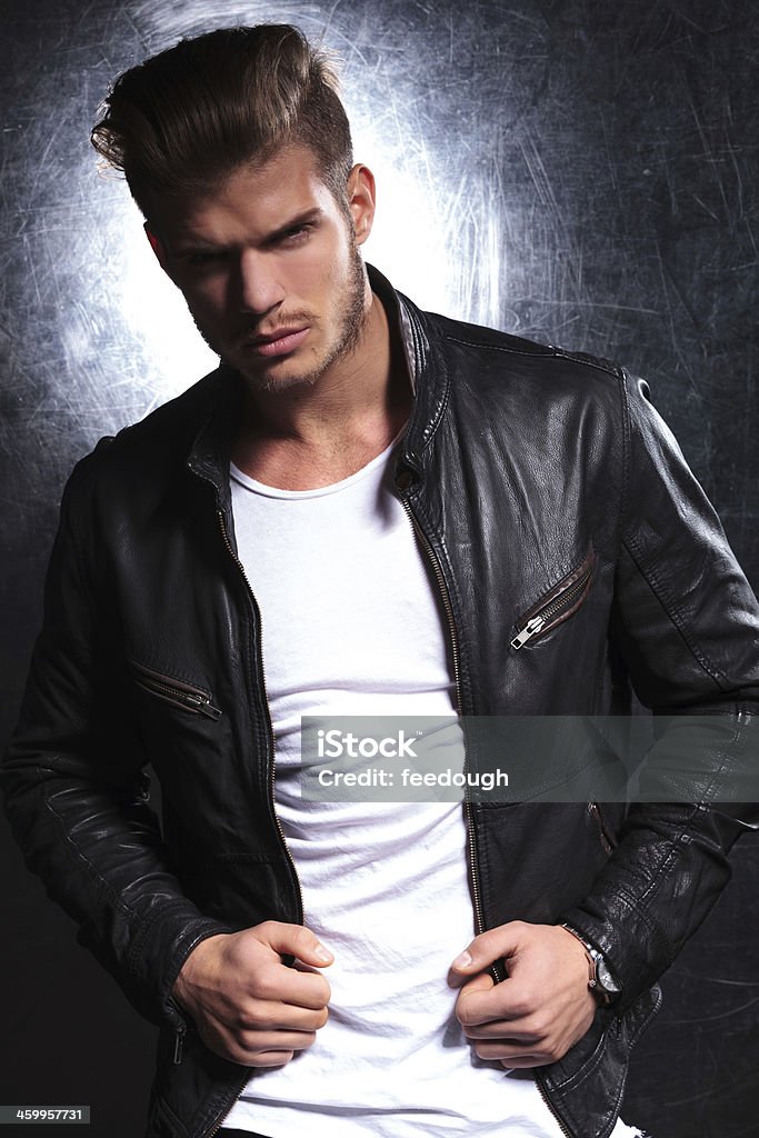 young fashion model in leather jacket young fashion model in leather jacket posing for the camera Adult Stock Photo