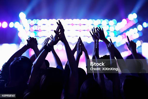Audience Watching A Rock Show Hands In The Air Stock Photo - Download Image Now - Nightclub, Multiracial Group, People