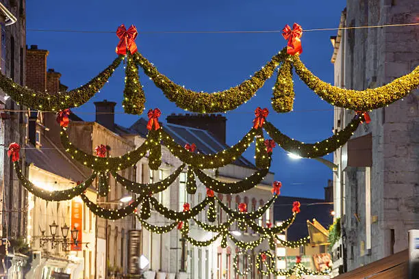 Shop street at night illuminated with Christmas lights, Galway, Ireland