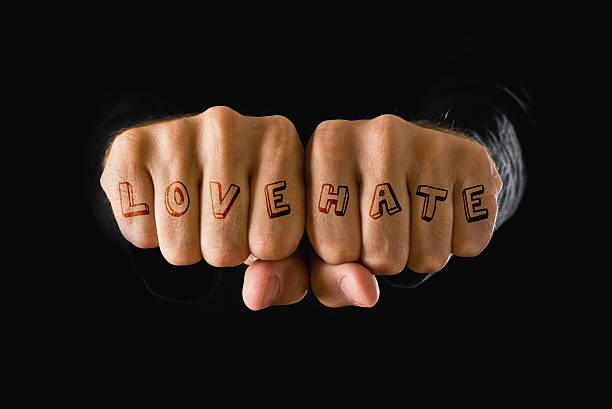 istock Love and hate tattooes, hands clenched in fist 459959731