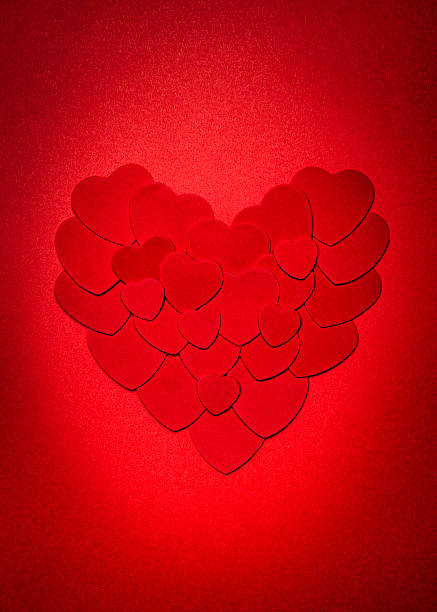 Red Valentines day heart Romantic heart made of many smaller red paper hearts for valentines day felt heart shape small red stock pictures, royalty-free photos & images