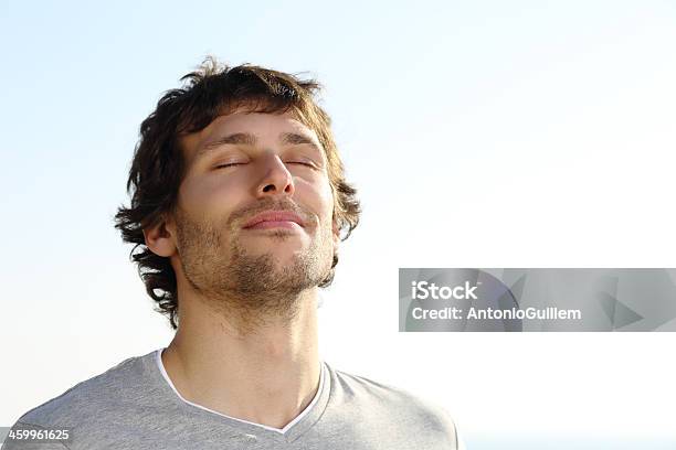 Attractive Man Breathing Outdoor Stock Photo - Download Image Now - Men, Inhaling, Breathing Exercise